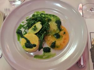 Squash blossom budino with heirloom tomatoes, basil, wild rocket and mint.